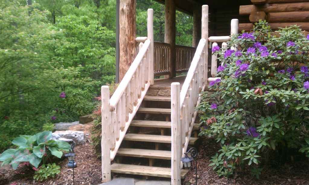 Cedar railing on a front porch Wiley Log Homes